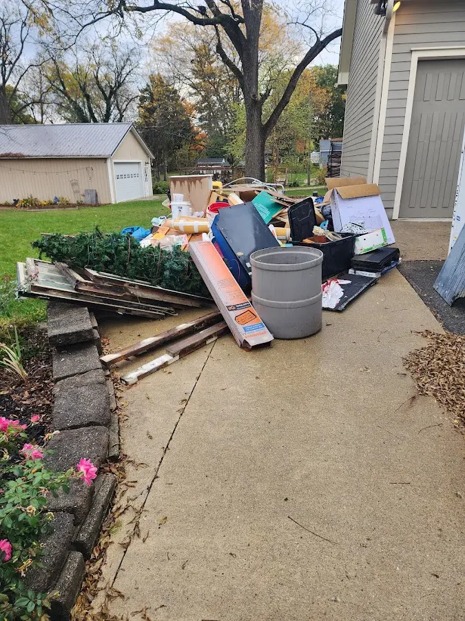 Dumpster being loaded with debris for Residential Dumpster Rental in Kimberly